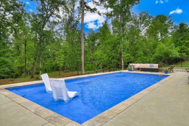 Experience elegant living in this beautifully designed 5-bedroom on Bartram Trail Golf Club in Georgia - for sale on GolfHomes.com, golf home, golf lot