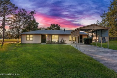 Welcome to this charming two-bedroom, one-bath home overlooking on Keystone Heights Golf and Country Club in Florida - for sale on GolfHomes.com, golf home, golf lot