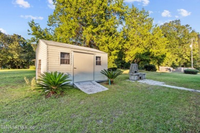 Welcome to this charming two-bedroom, one-bath home overlooking on Keystone Heights Golf and Country Club in Florida - for sale on GolfHomes.com, golf home, golf lot