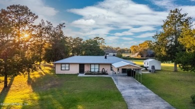 Welcome to this charming two-bedroom, one-bath home overlooking on Keystone Heights Golf and Country Club in Florida - for sale on GolfHomes.com, golf home, golf lot