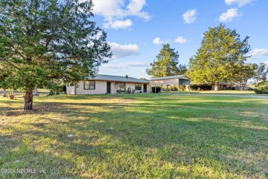 Welcome to this charming two-bedroom, one-bath home overlooking on Keystone Heights Golf and Country Club in Florida - for sale on GolfHomes.com, golf home, golf lot