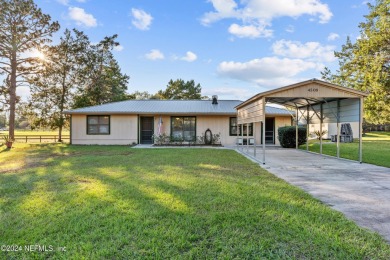 Welcome to this charming two-bedroom, one-bath home overlooking on Keystone Heights Golf and Country Club in Florida - for sale on GolfHomes.com, golf home, golf lot