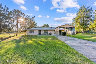 Welcome to this charming two-bedroom, one-bath home overlooking on Keystone Heights Golf and Country Club in Florida - for sale on GolfHomes.com, golf home, golf lot