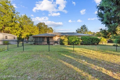 Welcome to this charming two-bedroom, one-bath home overlooking on Keystone Heights Golf and Country Club in Florida - for sale on GolfHomes.com, golf home, golf lot