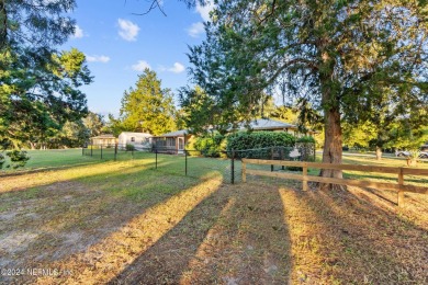 Welcome to this charming two-bedroom, one-bath home overlooking on Keystone Heights Golf and Country Club in Florida - for sale on GolfHomes.com, golf home, golf lot