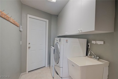 This very well-maintained 3-bedroom, 2-bathroom home is situated on Royal Tee Country Club in Florida - for sale on GolfHomes.com, golf home, golf lot