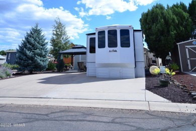 Modern living in this 2022 Cedar Creek Cottage, Destination RV on Juniper Ridge R.V. Golf Resort in Arizona - for sale on GolfHomes.com, golf home, golf lot