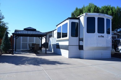Modern living in this 2022 Cedar Creek Cottage, Destination RV on Juniper Ridge R.V. Golf Resort in Arizona - for sale on GolfHomes.com, golf home, golf lot