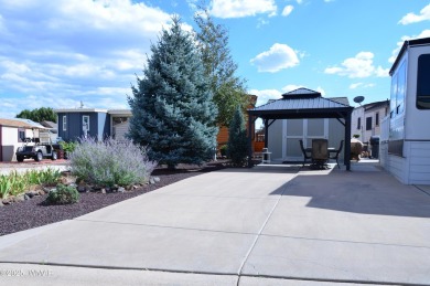 Modern living in this 2022 Cedar Creek Cottage, Destination RV on Juniper Ridge R.V. Golf Resort in Arizona - for sale on GolfHomes.com, golf home, golf lot