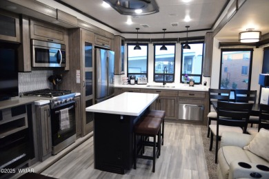 Modern living in this 2022 Cedar Creek Cottage, Destination RV on Juniper Ridge R.V. Golf Resort in Arizona - for sale on GolfHomes.com, golf home, golf lot