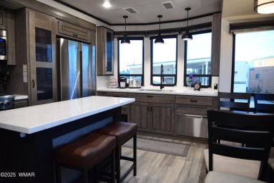 Modern living in this 2022 Cedar Creek Cottage, Destination RV on Juniper Ridge R.V. Golf Resort in Arizona - for sale on GolfHomes.com, golf home, golf lot