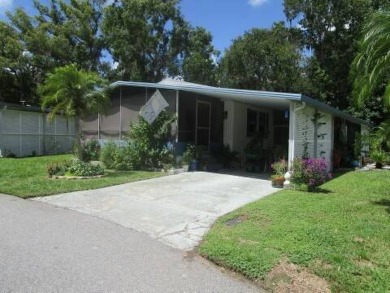 This charming 24 x 40, 2 bedrooms, 2 bath mobile home offers the on Grasslands Golf and Country Club in Florida - for sale on GolfHomes.com, golf home, golf lot