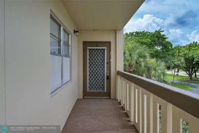 *CORNER UNIT* with a *WATER VIEW***MOTIVATED SELLER*** Parquet on Wynmoor Golf Course in Florida - for sale on GolfHomes.com, golf home, golf lot
