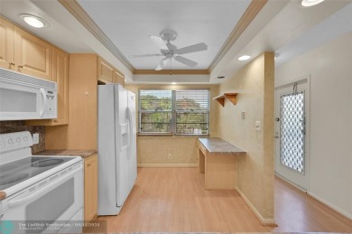 *CORNER UNIT* with a *WATER VIEW***MOTIVATED SELLER*** Parquet on Wynmoor Golf Course in Florida - for sale on GolfHomes.com, golf home, golf lot