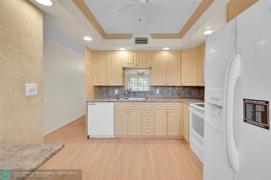 *CORNER UNIT* with a *WATER VIEW***MOTIVATED SELLER*** Parquet on Wynmoor Golf Course in Florida - for sale on GolfHomes.com, golf home, golf lot