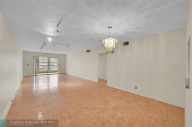 *CORNER UNIT* with a *WATER VIEW***MOTIVATED SELLER*** Parquet on Wynmoor Golf Course in Florida - for sale on GolfHomes.com, golf home, golf lot