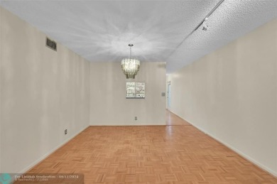 *CORNER UNIT* with a *WATER VIEW***MOTIVATED SELLER*** Parquet on Wynmoor Golf Course in Florida - for sale on GolfHomes.com, golf home, golf lot