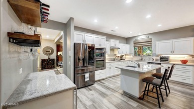 This move-in-ready home features include a stunning chef's on Sun City Grand Golf Couse and Club in Arizona - for sale on GolfHomes.com, golf home, golf lot