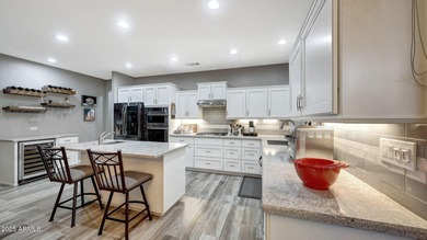 This move-in-ready home features include a stunning chef's on Sun City Grand Golf Couse and Club in Arizona - for sale on GolfHomes.com, golf home, golf lot