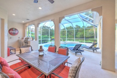 Welcome to your dream pool home nestled in the serene community on Halifax Plantation Golf Club in Florida - for sale on GolfHomes.com, golf home, golf lot