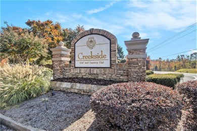 Welcome home to this charming 3-bedroom, 2.5-bath on Creekside Golf and Country Club in Georgia - for sale on GolfHomes.com, golf home, golf lot