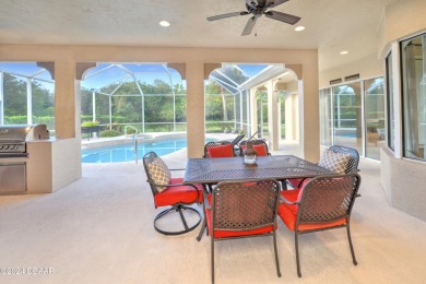 Welcome to your dream pool home nestled in the serene community on Halifax Plantation Golf Club in Florida - for sale on GolfHomes.com, golf home, golf lot