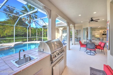 Welcome to your dream pool home nestled in the serene community on Halifax Plantation Golf Club in Florida - for sale on GolfHomes.com, golf home, golf lot