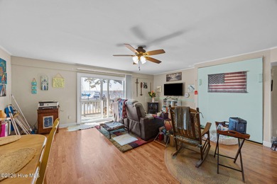 Enjoy stunning waterfront views from this charming 1 bedroom on Harbour Point Golf Club in North Carolina - for sale on GolfHomes.com, golf home, golf lot