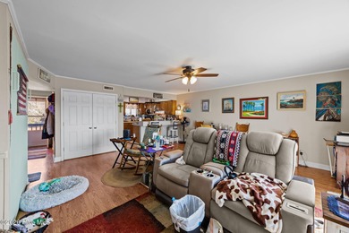 Enjoy stunning waterfront views from this charming 1 bedroom on Harbour Point Golf Club in North Carolina - for sale on GolfHomes.com, golf home, golf lot