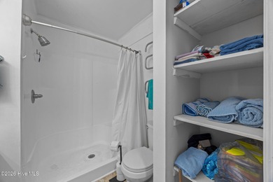 Enjoy stunning waterfront views from this charming 1 bedroom on Harbour Point Golf Club in North Carolina - for sale on GolfHomes.com, golf home, golf lot