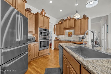 Welcome to 8948 Woodcreek Circle - where this 2006 built home on Porters Neck Country Club in North Carolina - for sale on GolfHomes.com, golf home, golf lot