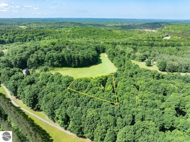 Tucked away in a private setting with frontage on the 13th hole on Schuss Mountain Golf Club in Michigan - for sale on GolfHomes.com, golf home, golf lot