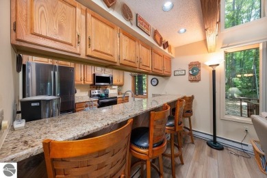 Tucked away in a private setting with frontage on the 13th hole on Schuss Mountain Golf Club in Michigan - for sale on GolfHomes.com, golf home, golf lot