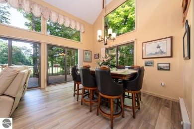Tucked away in a private setting with frontage on the 13th hole on Schuss Mountain Golf Club in Michigan - for sale on GolfHomes.com, golf home, golf lot