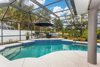 Welcome to this stunning 3-bedroom, 2-full-bath pool home on The Grand Club Cypress Course in Florida - for sale on GolfHomes.com, golf home, golf lot