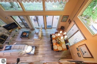 Tucked away in a private setting with frontage on the 13th hole on Schuss Mountain Golf Club in Michigan - for sale on GolfHomes.com, golf home, golf lot