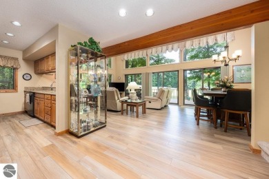Tucked away in a private setting with frontage on the 13th hole on Schuss Mountain Golf Club in Michigan - for sale on GolfHomes.com, golf home, golf lot