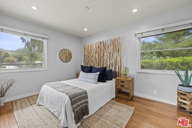 Perched above the Woodland Hills Country Club, this classic 1953 on Woodland Hills Country Club in California - for sale on GolfHomes.com, golf home, golf lot