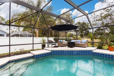 Welcome to this stunning 3-bedroom, 2-full-bath pool home on The Grand Club Cypress Course in Florida - for sale on GolfHomes.com, golf home, golf lot