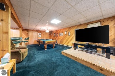 Tucked away in a private setting with frontage on the 13th hole on Schuss Mountain Golf Club in Michigan - for sale on GolfHomes.com, golf home, golf lot