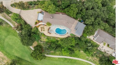 Perched above the Woodland Hills Country Club, this classic 1953 on Woodland Hills Country Club in California - for sale on GolfHomes.com, golf home, golf lot