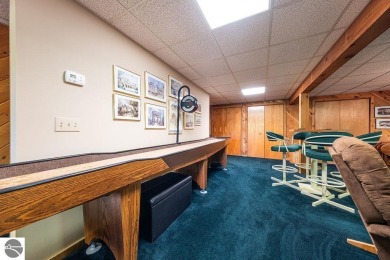 Tucked away in a private setting with frontage on the 13th hole on Schuss Mountain Golf Club in Michigan - for sale on GolfHomes.com, golf home, golf lot