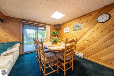 Tucked away in a private setting with frontage on the 13th hole on Schuss Mountain Golf Club in Michigan - for sale on GolfHomes.com, golf home, golf lot