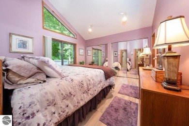 Tucked away in a private setting with frontage on the 13th hole on Schuss Mountain Golf Club in Michigan - for sale on GolfHomes.com, golf home, golf lot