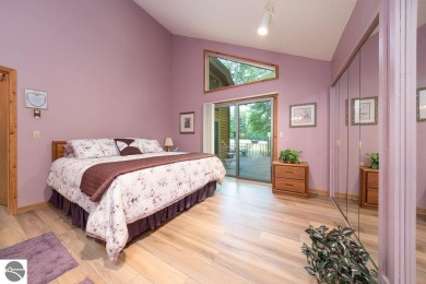 Tucked away in a private setting with frontage on the 13th hole on Schuss Mountain Golf Club in Michigan - for sale on GolfHomes.com, golf home, golf lot