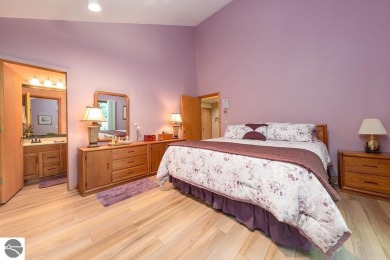 Tucked away in a private setting with frontage on the 13th hole on Schuss Mountain Golf Club in Michigan - for sale on GolfHomes.com, golf home, golf lot
