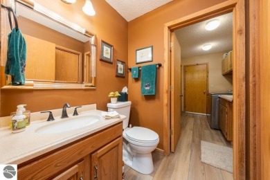 Tucked away in a private setting with frontage on the 13th hole on Schuss Mountain Golf Club in Michigan - for sale on GolfHomes.com, golf home, golf lot