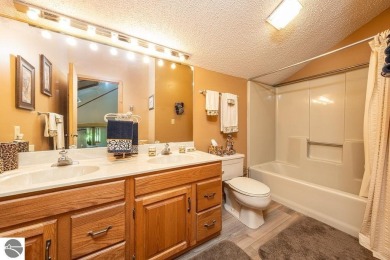 Tucked away in a private setting with frontage on the 13th hole on Schuss Mountain Golf Club in Michigan - for sale on GolfHomes.com, golf home, golf lot