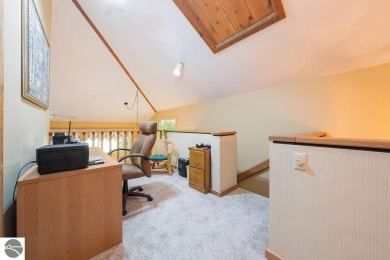 Tucked away in a private setting with frontage on the 13th hole on Schuss Mountain Golf Club in Michigan - for sale on GolfHomes.com, golf home, golf lot