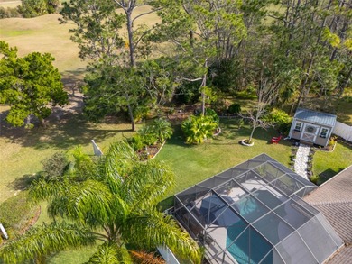 Welcome to this stunning 3-bedroom, 2-full-bath pool home on The Grand Club Cypress Course in Florida - for sale on GolfHomes.com, golf home, golf lot